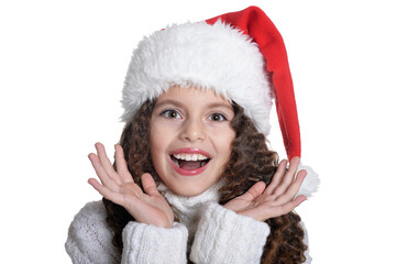 Portrait of smiling little girl in Santa hat