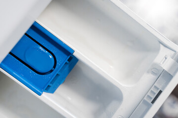 Compartment in the washing machine for powder