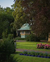 An old gazebo embedded in the lush green park called Stadsparken in Lund Sweden