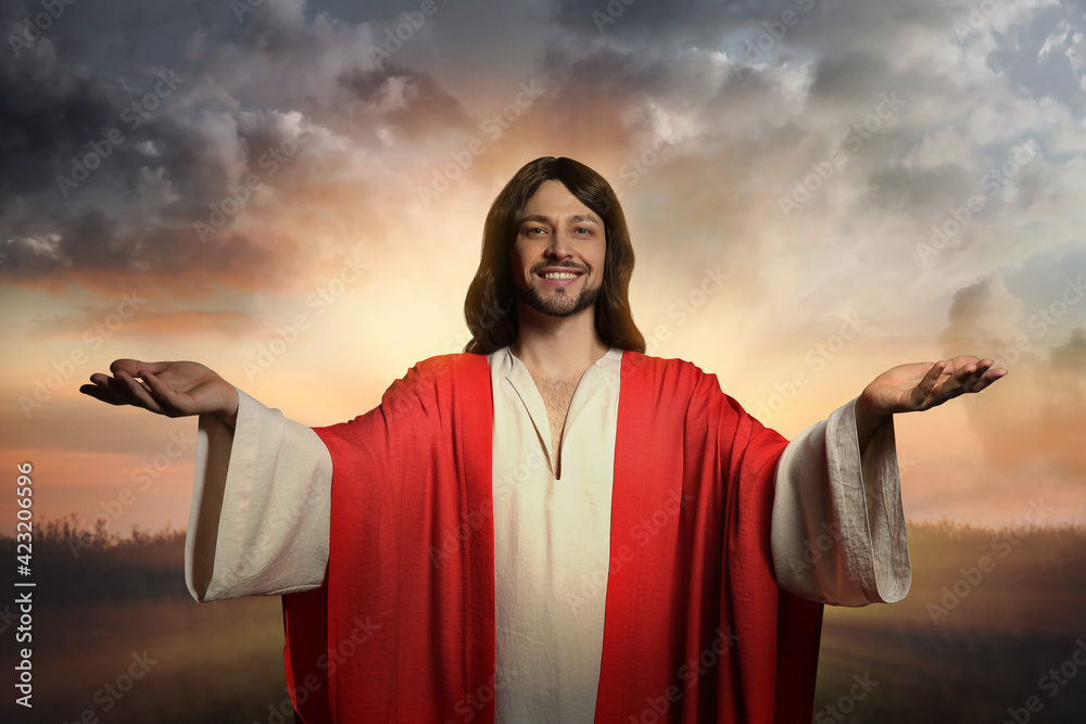 Wall mural Jesus Christ with outstretched arms outdoors