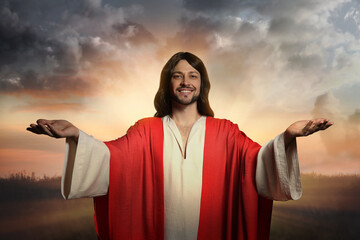 Jesus Christ with outstretched arms outdoors