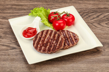 Grilled burger cutlet with sauce
