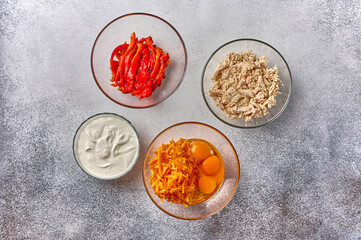 Ingredients - chicken, eggs, cheese, sour cream for homemade quiche pie, top view, copy space