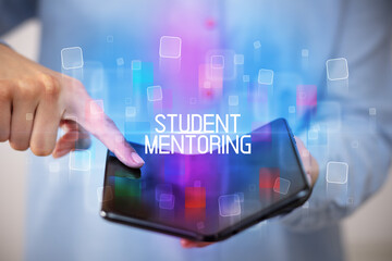 Young man holding a foldable smartphone