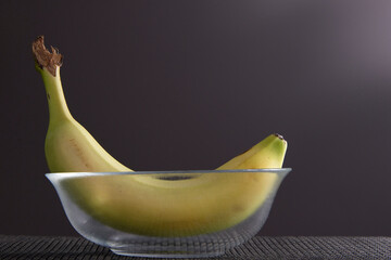 Banana in a clear glass bowl