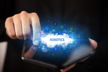 Businessman holding a foldable smartphone, technology concept