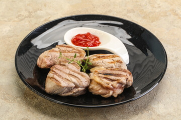 Grilled pork tenderlion with tomato sauce
