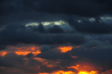 Fototapeta na wymiar crimson and gray sky at sunset
