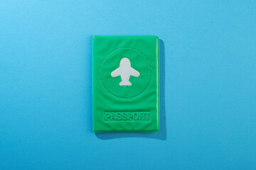 green color passport cover on blue background