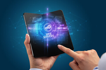 Businessman holding a foldable smartphone, technology concept