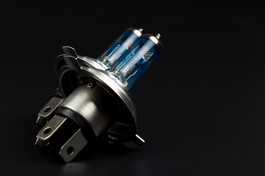 blue car head light bulb on black background