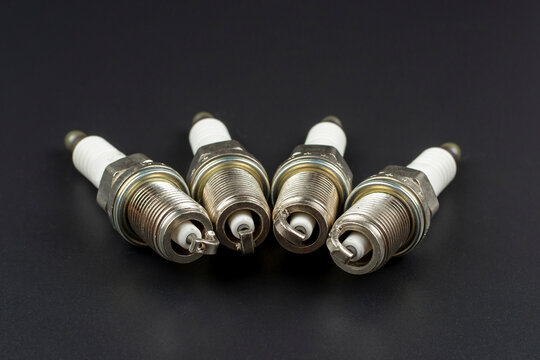 spark plugs for car close up on black background
