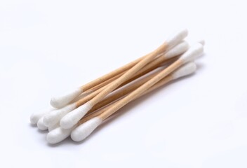 A heap of ecological paper cotton swabs on white background