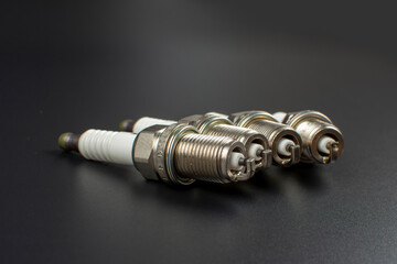 spark plugs for car close up on black background