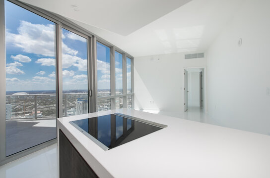 Island flat stove cooktop with vacant condo view