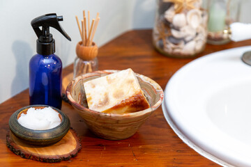 Natural personal care items on a wooden bathroom counter