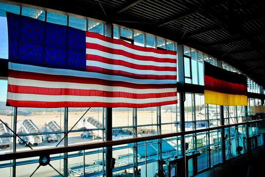 Ramstein, Germany: Ramstein Air Base PAX Passenger terminal. American and German flags hang in the main gateway for the Kaiserslautern Military Community of Americans living in Germany.