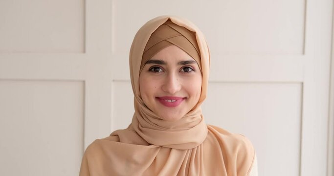 Portrait Of Beautiful Muslim Woman Smiling At Home