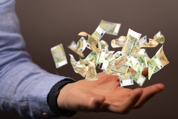 money euro banknote in hand rain