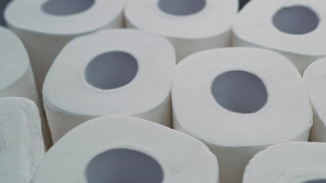 Rolls Of Soft Multi-Layer Toilet Paper, Macro, Rotation. Toilet Paper Isolated Background. Toilet Paper Rolls for Hygiene and Cleanliness.