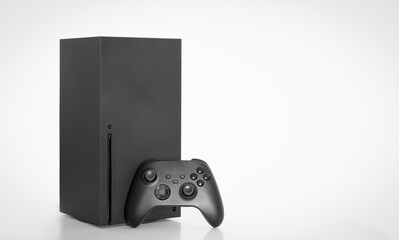 Next Generation game console and controller on white background. © miglagoa