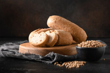 Gluten-free healthy buckwheat bread on black background with copy space. Close up.