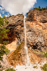 Rinka waterfall located in Logarska dolina national park in Slovenia, Second highest waterfall in Slovenia. Popular hiking destination in the Alps © Zedspider