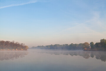 Morning fog over the calm river. The river Dnipro.