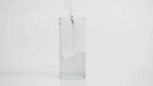 Slow Motion of Pouring Sparkling Water in Glass, 1000 fps in White Background 