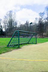 Outdoor football pitch with goals and soccer nets in public park