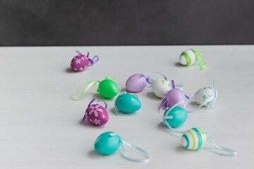 Pastel color plastic Easter eggs decoration on a light background