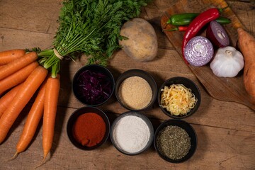 vegetables and spices on a wooden table
