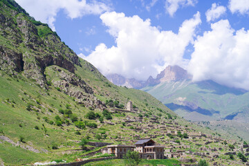 The burial tower of Abai-Kala on the background of an ancient abandoned village. Chegetskoe gorge