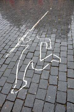 Kunst Jogger aufgemalt auf Pflastersteine in Maastricht Leiche