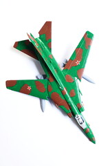 Fototapeta na wymiar Russian plane Mig-23 from Cold War time. Hand painted toy, glued plastic plane.