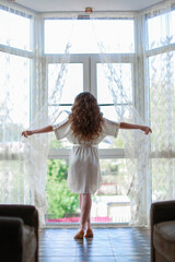 girl looking out window