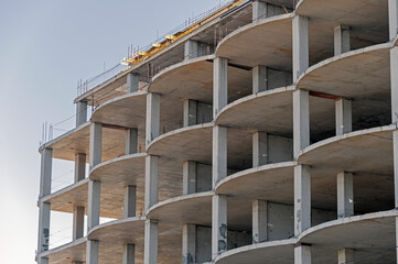 The facade of modern residential building under construction