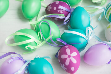 Fototapeta na wymiar Pastel color plastic Easter eggs decoration on a light background
