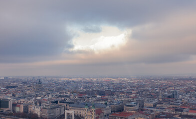 Hole in the clouds above Budapest. Cloudy winter day.