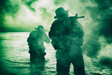 Commando soldiers walking in water, army special operations forces fighters sneaking in darkness,...
