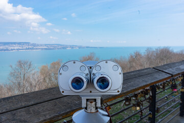 stationary paid binoculars on the observation deck overlooking the sea bay