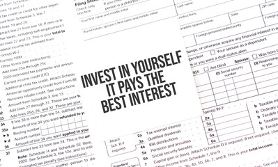 Yellow Paper Note With Words Invest in Yourself It pays the best interest , Tax concept