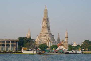 View of the prangs of the Buddhist temple of Wat Arun in the sunny morning, Bangkok