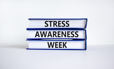 Stress awareness week symbol. Books with words 'Stress awareness week'. Beautiful white background. Psychological, business and stress awareness week concept. Copy space.