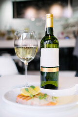 glasses of wine and grill Salmon on table