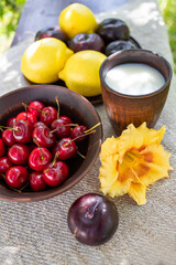 fruits and berries and a glass of milk