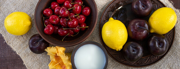 fruits and berries and a glass of milk