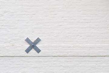 Wall detail with white painted bricks at a Dutch countryside house - 423250750