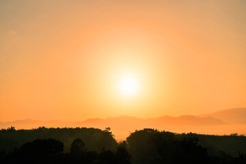 Blue sky background with little clouds, morning sun rising up. In Phuket, Thailand