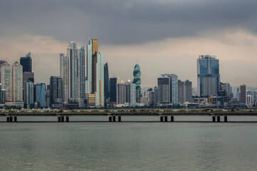 Naklejka premium Construction boom in Panama City. Skyline of Panama City on a cloudy day with modern buildings. View from Cinta Costera